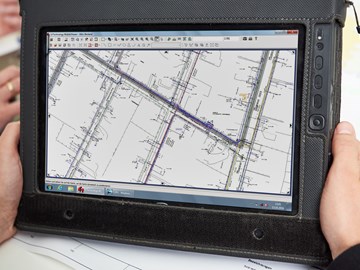 Baupläne auf einem Tablet - Nahaufnahme Baupläne auf einem Tablet - Nahaufnahme